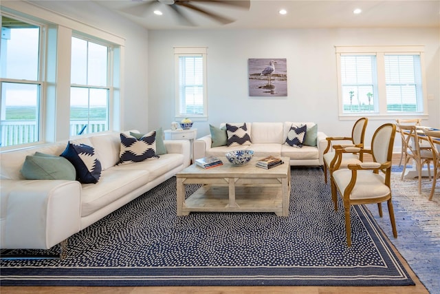 living room with ceiling fan and a wealth of natural light