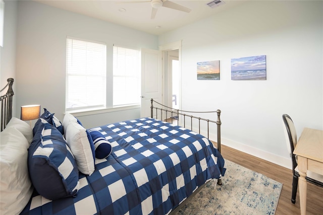 bedroom featuring wood-type flooring and ceiling fan