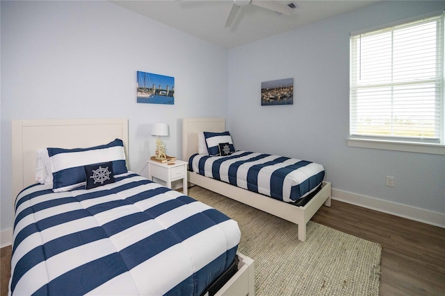 bedroom featuring dark hardwood / wood-style floors and ceiling fan