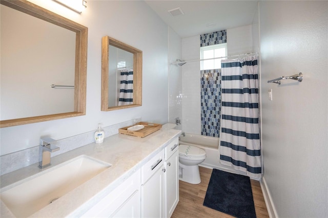 full bathroom with shower / bath combo, toilet, wood-type flooring, and vanity