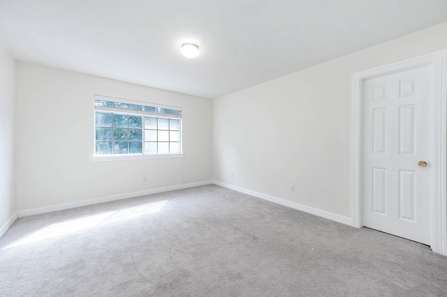 empty room featuring light colored carpet