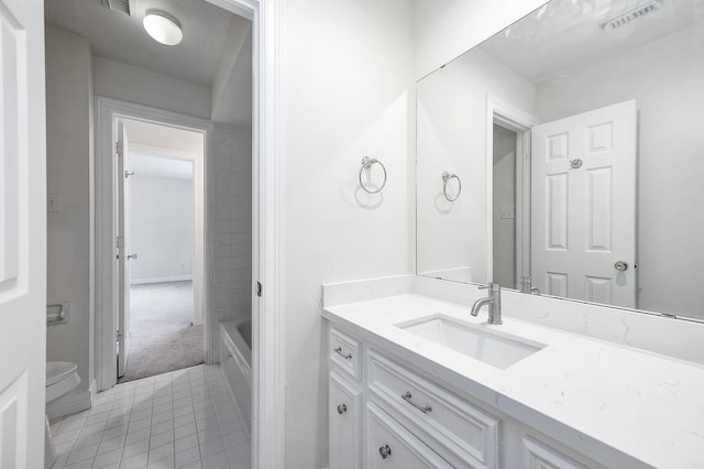 full bathroom with tile patterned floors, vanity, toilet, and independent shower and bath