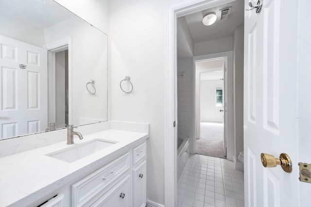 bathroom featuring tile patterned floors, vanity, and toilet