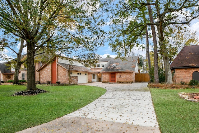 view of front facade with a garage and a front yard