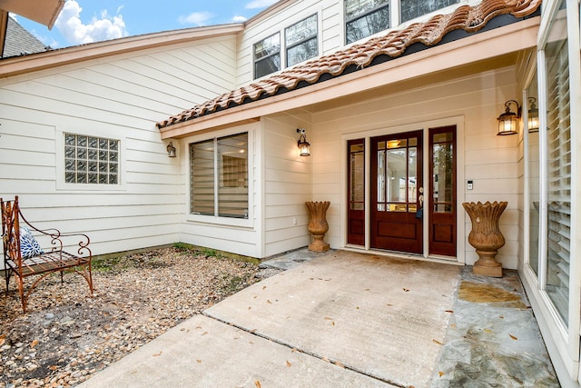 doorway to property featuring a patio