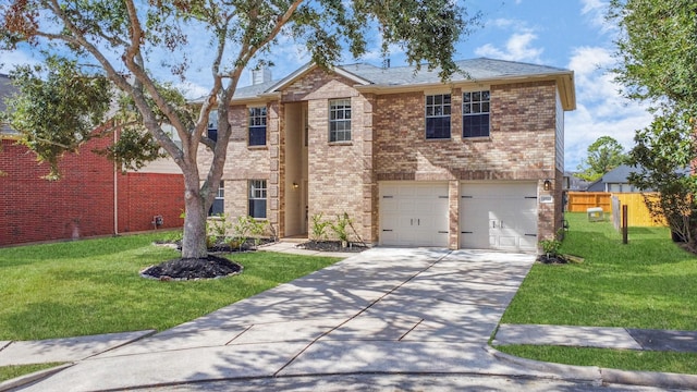 view of front of house featuring a front lawn and a garage