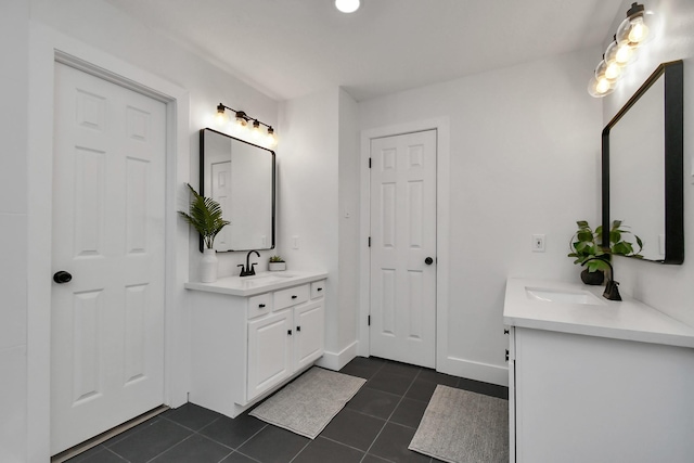 bathroom with tile patterned floors and vanity