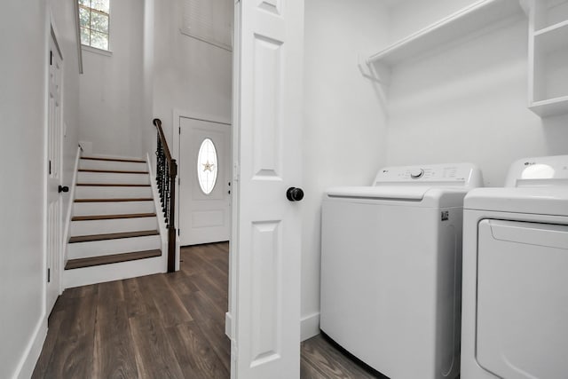 laundry area featuring separate washer and dryer and dark wood-type flooring