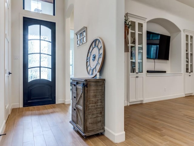 foyer with light hardwood / wood-style floors