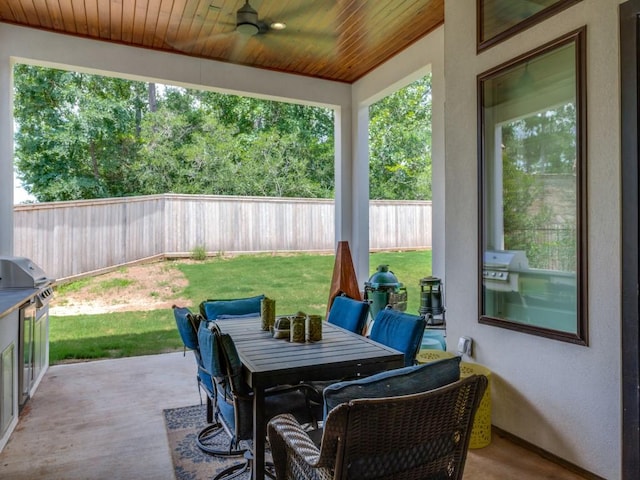 view of patio with ceiling fan and area for grilling