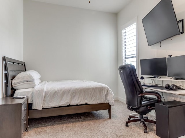 bedroom featuring light colored carpet