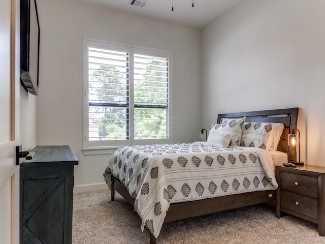 bedroom with light colored carpet