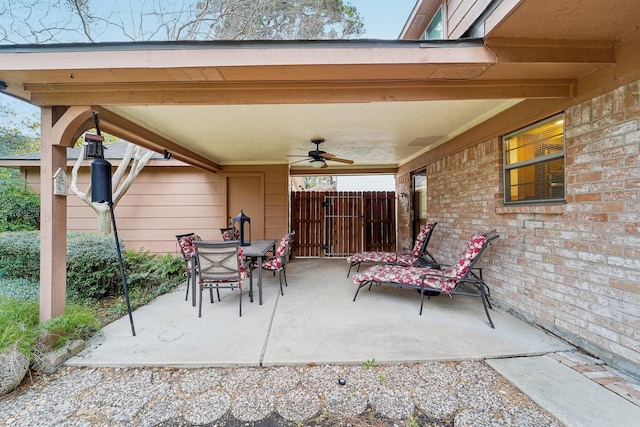 view of patio featuring ceiling fan