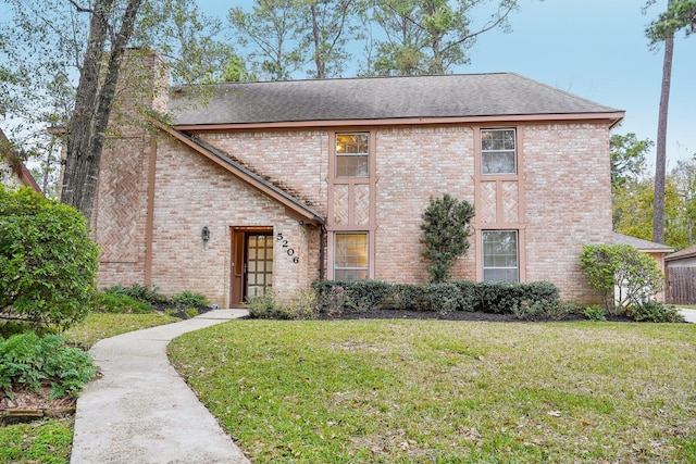 view of front of home with a front lawn