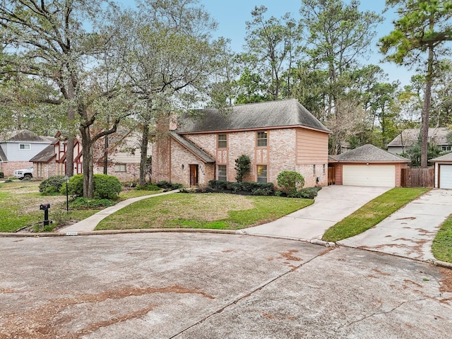 view of front facade with a front yard and a garage