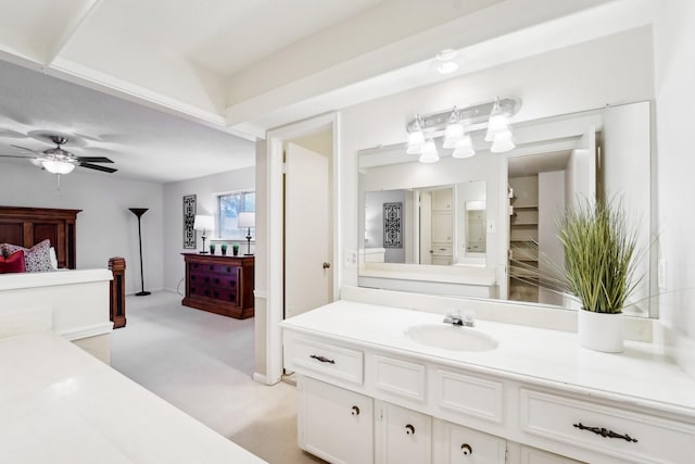 bathroom featuring ceiling fan and vanity