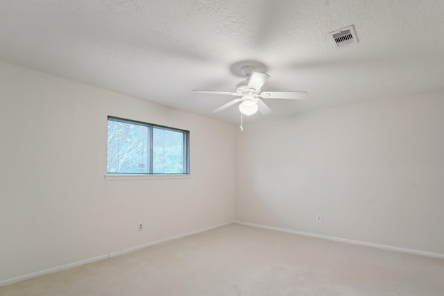 empty room with carpet floors and ceiling fan