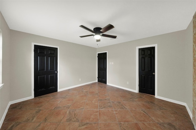 unfurnished room with ceiling fan