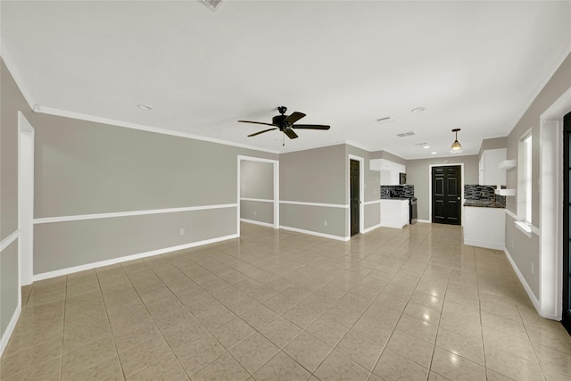 unfurnished living room with ceiling fan, light tile patterned flooring, and ornamental molding