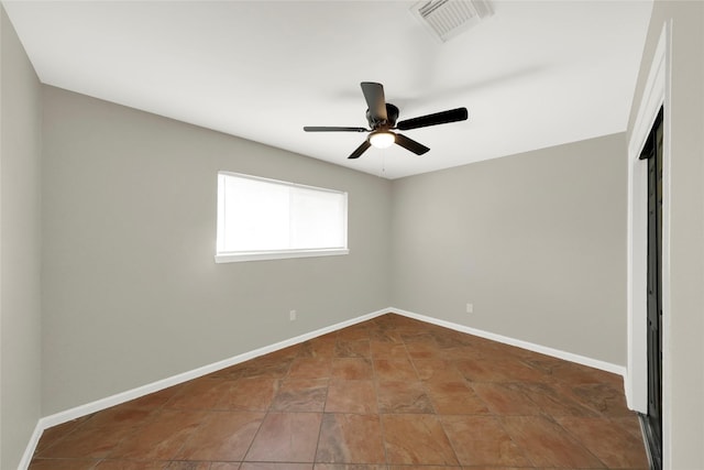 spare room with ceiling fan