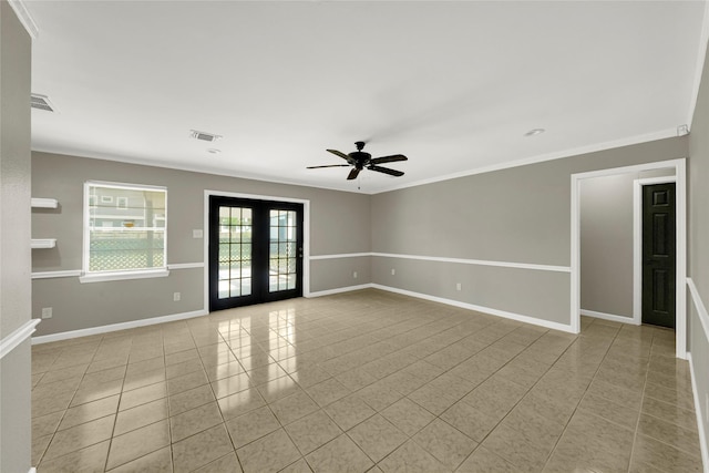 tiled spare room with crown molding, french doors, and ceiling fan