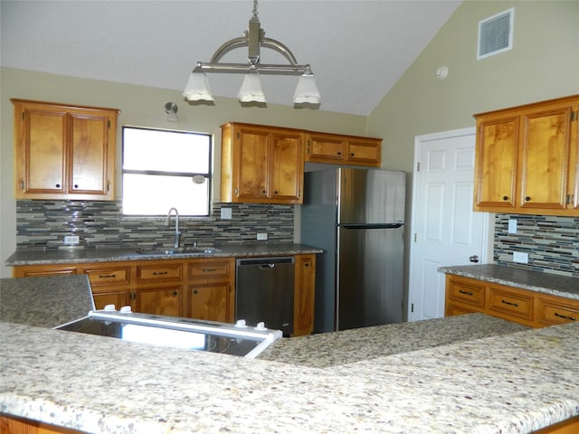 kitchen with dishwasher, stainless steel fridge, sink, and backsplash