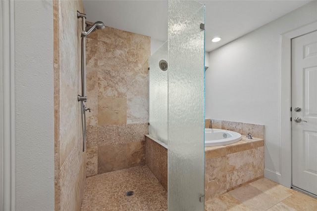 bathroom with separate shower and tub