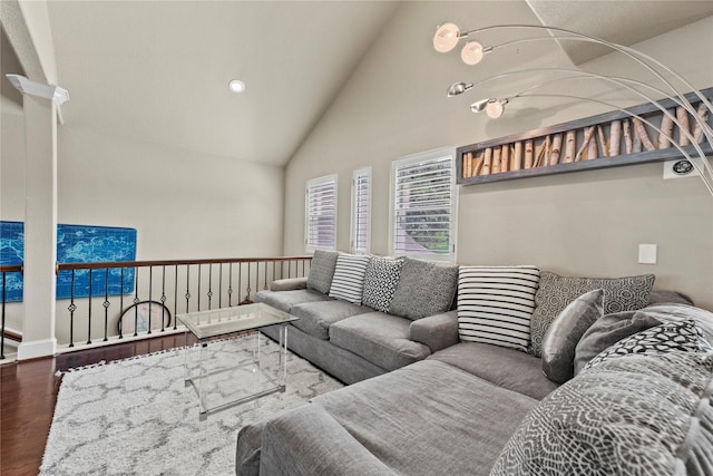 living room featuring hardwood / wood-style flooring and high vaulted ceiling