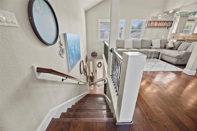 stairs with wood-type flooring and sink