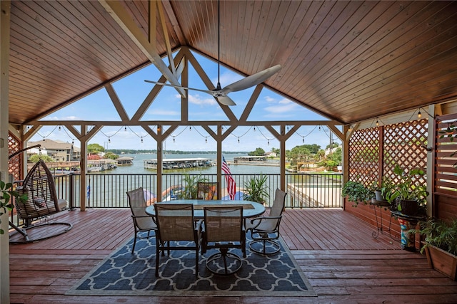 wooden terrace featuring a gazebo, a water view, and ceiling fan