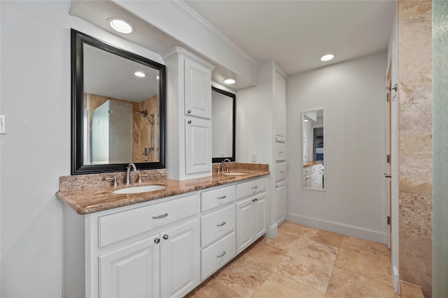 bathroom featuring crown molding and vanity