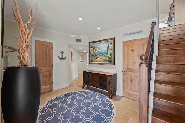 foyer entrance featuring ornamental molding