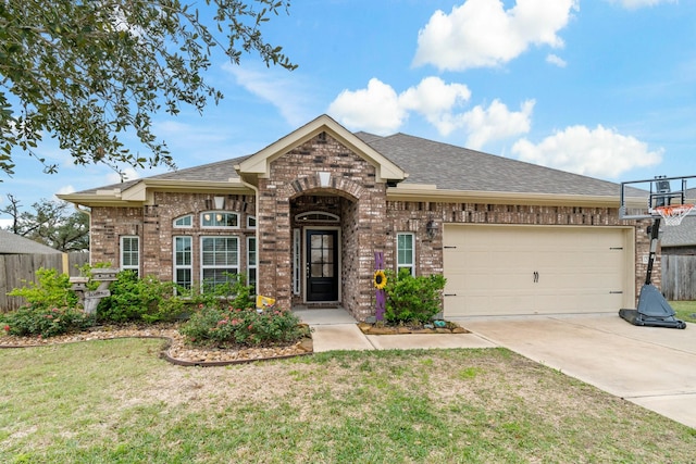 view of front of house with a garage and a front lawn