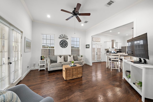 living room featuring french doors, crown molding, ceiling fan, and dark wood-type flooring