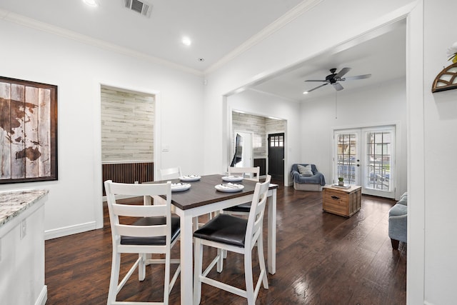 dining space with ceiling fan, french doors, crown molding, and dark hardwood / wood-style floors