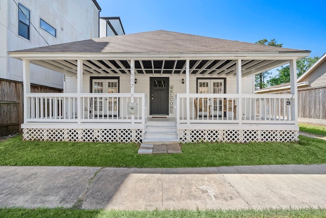 exterior space with a porch and a front lawn