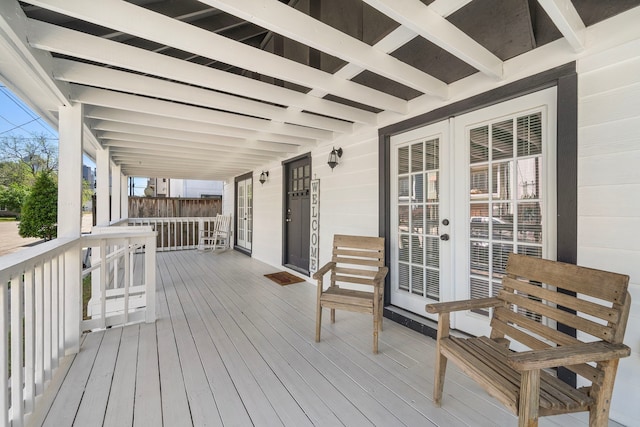 deck with a porch and french doors