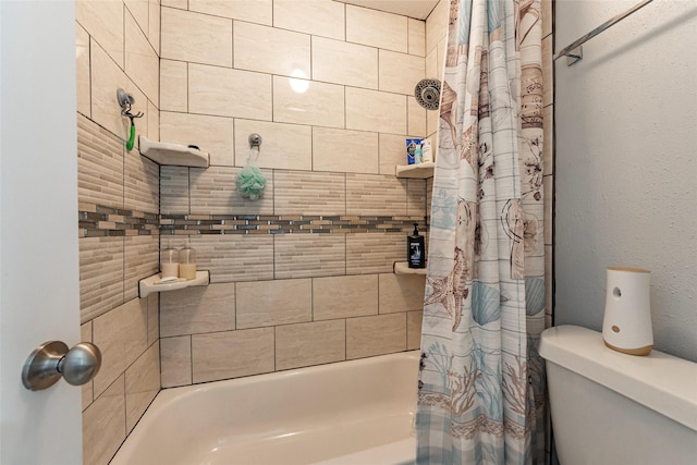 bathroom featuring toilet and shower / bath combo with shower curtain