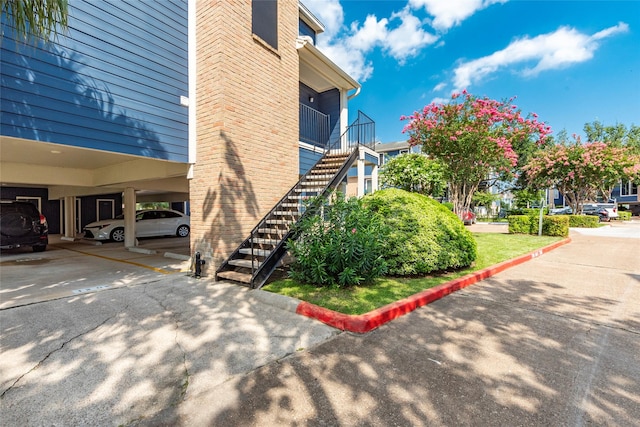 view of property exterior featuring a carport