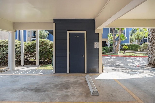 foyer entrance featuring concrete flooring