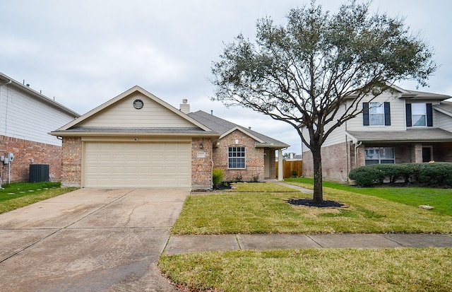 view of front of home with a front yard, a garage, and central AC unit