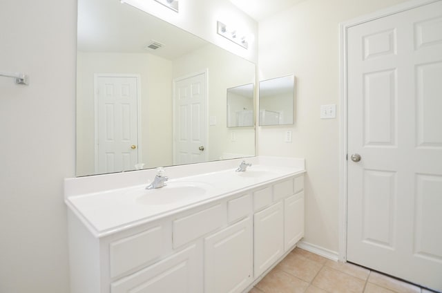 bathroom featuring tile patterned floors and vanity