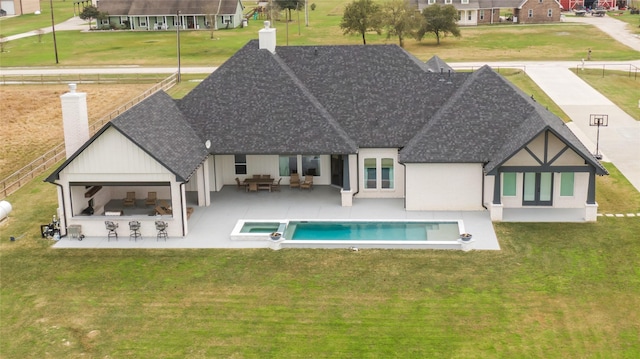 rear view of house featuring an outdoor bar, a patio area, and an outdoor living space