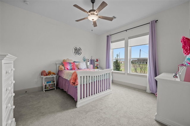 carpeted bedroom with ceiling fan