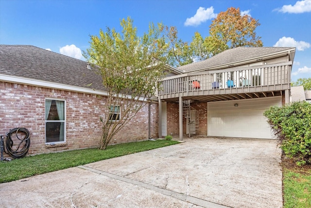 front facade with a deck and a garage