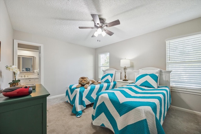 carpeted bedroom with a textured ceiling and ceiling fan