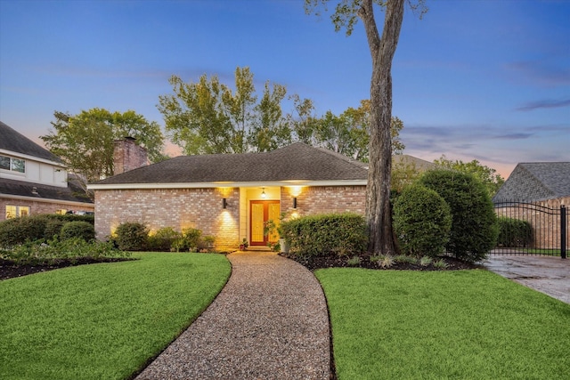 view of front of house with a lawn