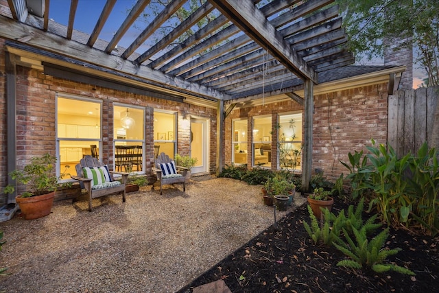 patio terrace at dusk with a pergola