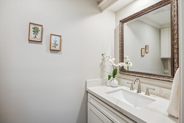 bathroom featuring vanity and ornamental molding