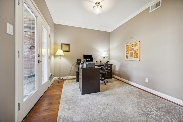 office space featuring crown molding, hardwood / wood-style floors, and french doors